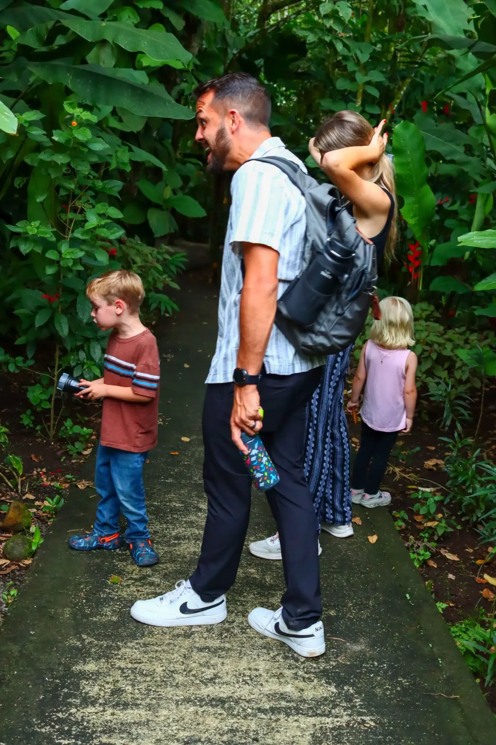 Family enjoying a rainforest night walk tour in La Fortuna Costa Rica | Night Walk Arenal Volcano wildlife experience