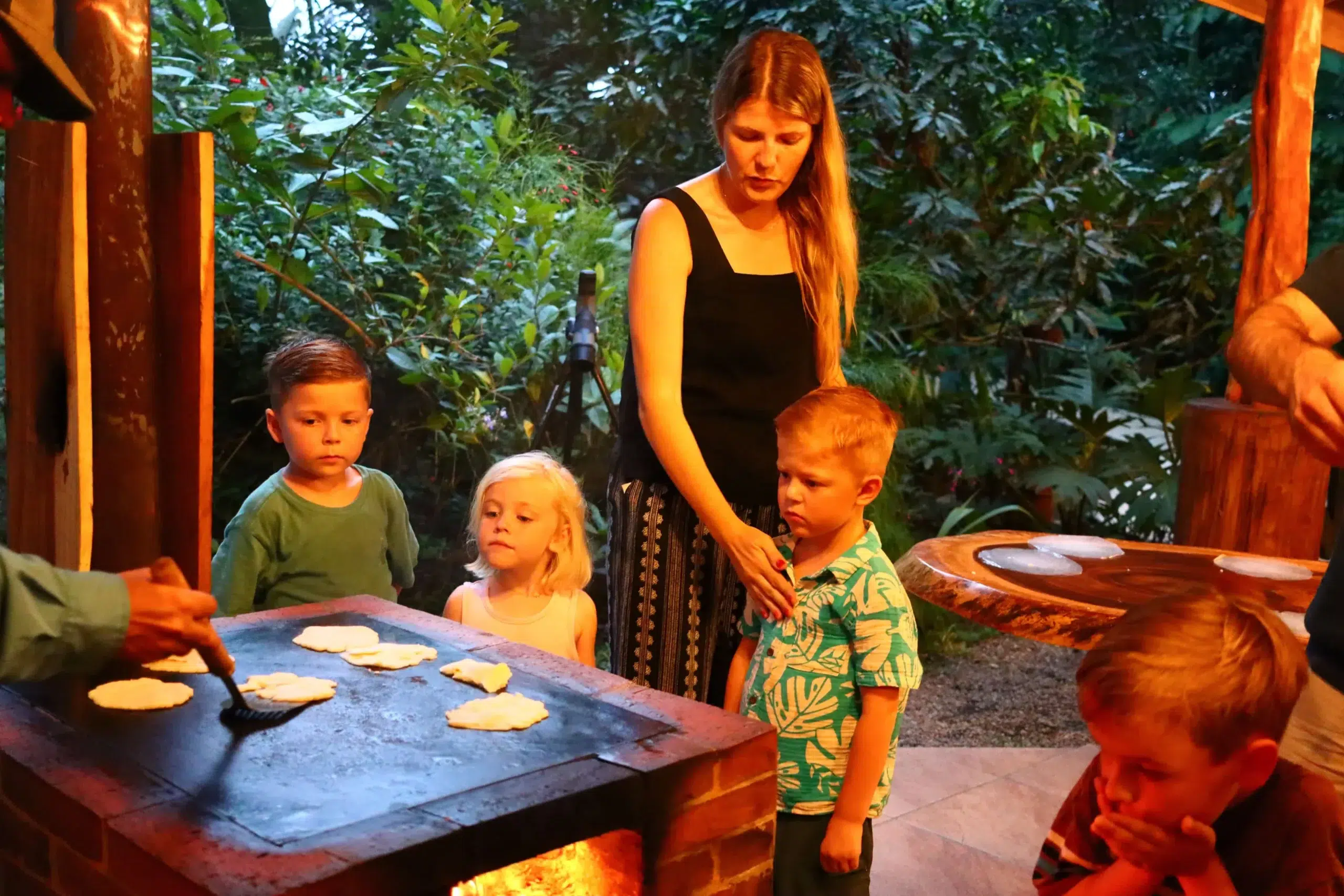Family experiencing a Night Walk in La Fortuna Costa Rica | Kids learning traditional culture and enjoying a guided night tour in the rainforest
